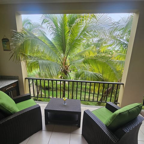 Large balcony with comfortable lounge furniture.