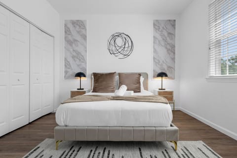 Stylish queen bedroom! Shares a hallway bathroom with the kids space room.
