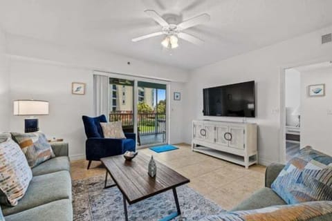 Comfortable seating, smart TV, and balcony access.