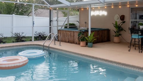 Delight in the wonders of a fully private hot tub and heated pool. 