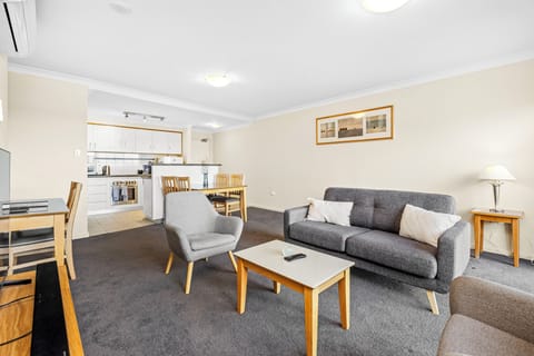 Relax and unwind in the spacious living room, designed for comfort and convenience.