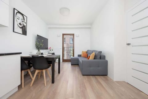 Living room with a comfortable sofa and TV. 