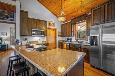 Cook with a view — this well-equipped kitchen offers everything you need, with the stovetop perfectly placed to overlook the stunning scenery beyond.