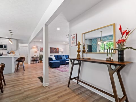 Follow the elegant hallway to discover our airy and open living and kitchen area, perfect for gathering and entertaining.
