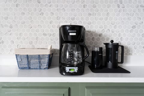 Coffee setup in main level kitchen. Drip, french press, grinder and essentials