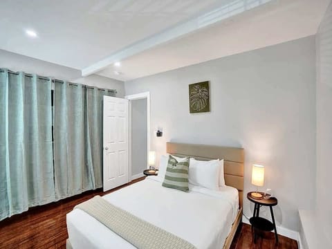 Cozy queen bedroom with warm lighting and decor