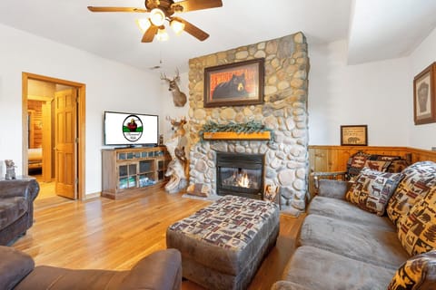 Comfortable Living Room with Cable TV, Sleeper Sofa, and a Seasonal Fireplace