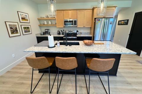 The bar seating is perfect for morning coffee or evening drinks.