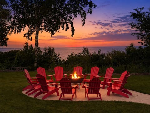 Enjoy our fire pit overlooking Lake Michigan. You can hear the seagulls and waves crashing while feeling the warmth of the fire. It's an incredible experience.