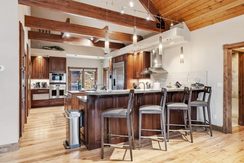 A bistro style table and chairs in the kitchen corner provides a perfect quiet spot for enjoying your cup of coffee while taking in the views.