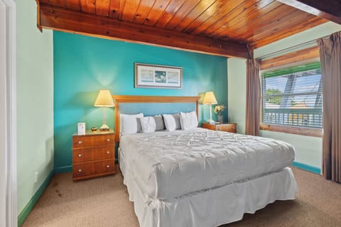 Room 7 is located on the 2nd floor of the Inlet Building. It has a king-size bed and a window overlooking the ocean.