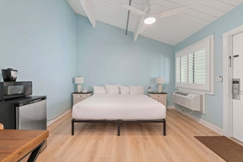 Room 11 is located on the 3rd floor of the Inlet Building. It has a king-size bed and a shared balcony for access.
