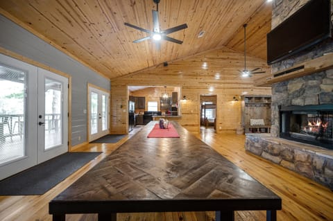 Dining table with 3 sets of French doors to enjoy the view!