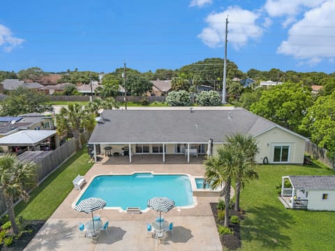 Gorgeous backyard with covered patio area, pool and hot tub. 