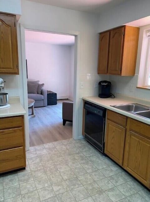 Fully stocked Kitchen opens up on both sides to main living spaces.