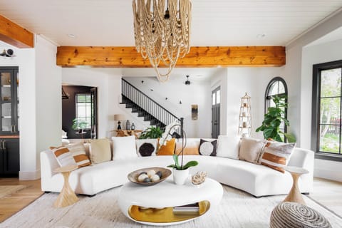 Living and room and front entrance facing Main street. This room will also be featured on HGTV Fixer to Fabulous promo spot. You can design your own version of our living room in the Design Home app. 