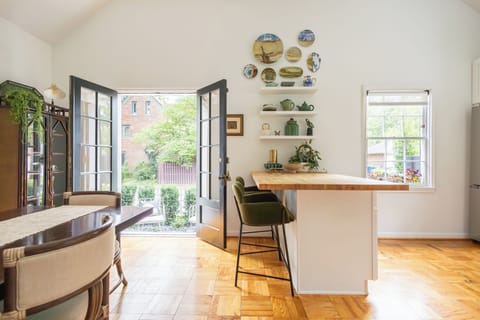 Kitchen bar seats two. Entry to outdoor side yard.