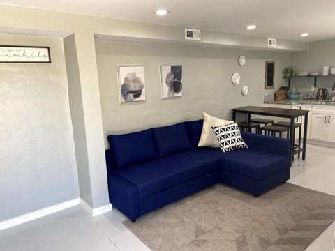 Living room area with sofa bed and smart TV