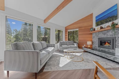 Living Room: 3-person couch, 2-person couch, chair, 46” Smart TV, gas fireplace, upper floor