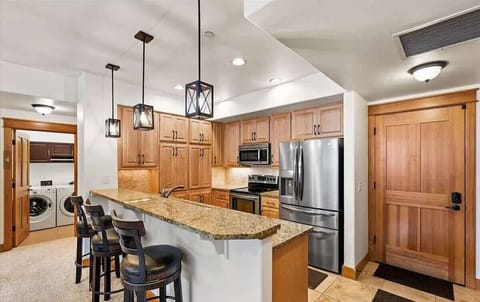 Fully Equipped Kitchen Featuring Stainless Steel Appliances and Granite Countertops