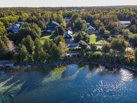 Welcome to Harbourview: Nestled in Tobermory's beautiful coastline. Serene waters and lush greenery surround the cottage.