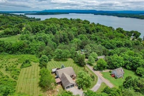 Huge fenced yard and a long paved driveway to park your boat, just across the street from the lake