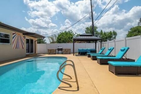 Sunbathe in style—spacious poolside haven with loungers perfect for groups to soak up the sun!