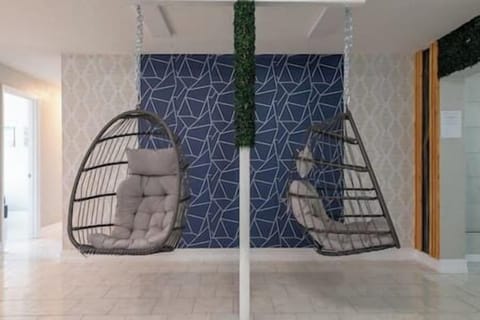 Relax in style in our egg basket hanging chairs amidst geometric backdrops