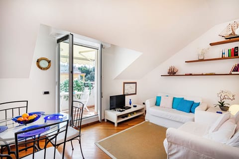 Apartment, City View | Living area | 35-inch TV with digital channels