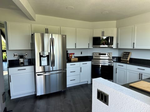 Bright kitchen with brand new stainless steel appliances