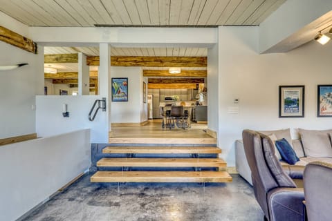 Well appointed kitchen and dining room steps away from the cozy family room, hot tub, grill  and dual staircases that lead to bedrooms and gameroom