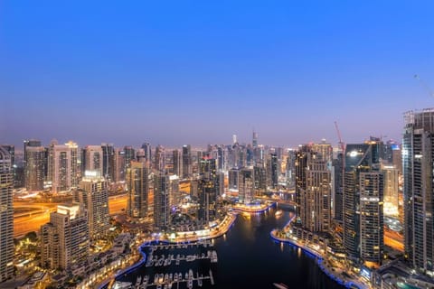 Cityscape View: Experience stunning skyline views from your private balcony at sunset!