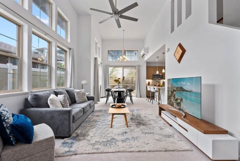 Bright and airy living room with high ceilings and modern comfort