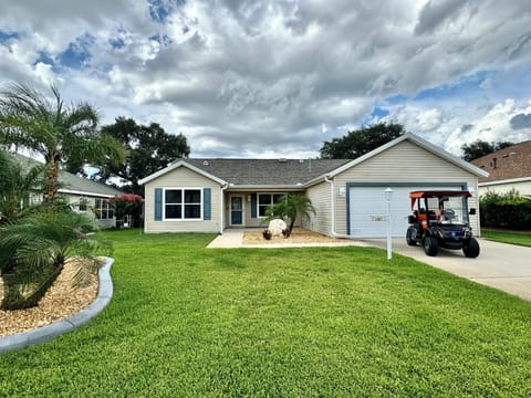 House Front with Golf Cart for Guest Use