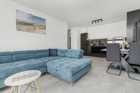 Relax in the stylish living room with a comfortable sofa and modern decor.