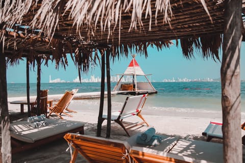 Private beach, white sand, beach cabanas, sun loungers