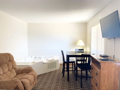 Suite, 1 King Bed | Iron/ironing board, free WiFi, bed sheets