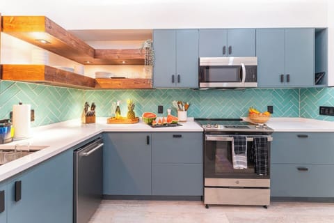 Custom kitchen with honeydew backsplash