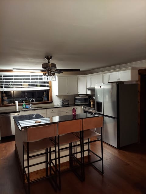 Lots of seating for eating or visiting while cooking makes this kitchen inviting