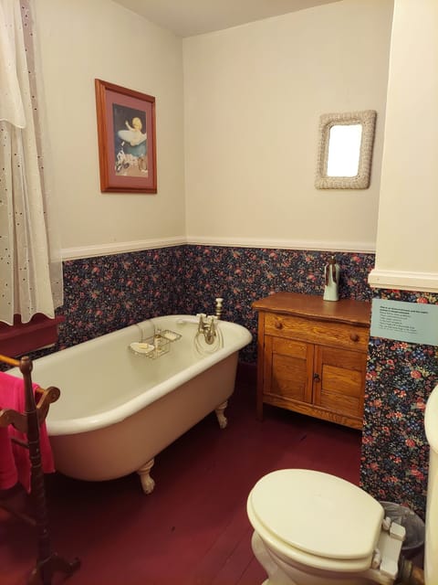 This downstairs bathroom offers a clawfoot soaking tub; great for relaxing.