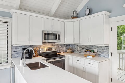 Kitchen provides everything necessary to cook and serve basic meals