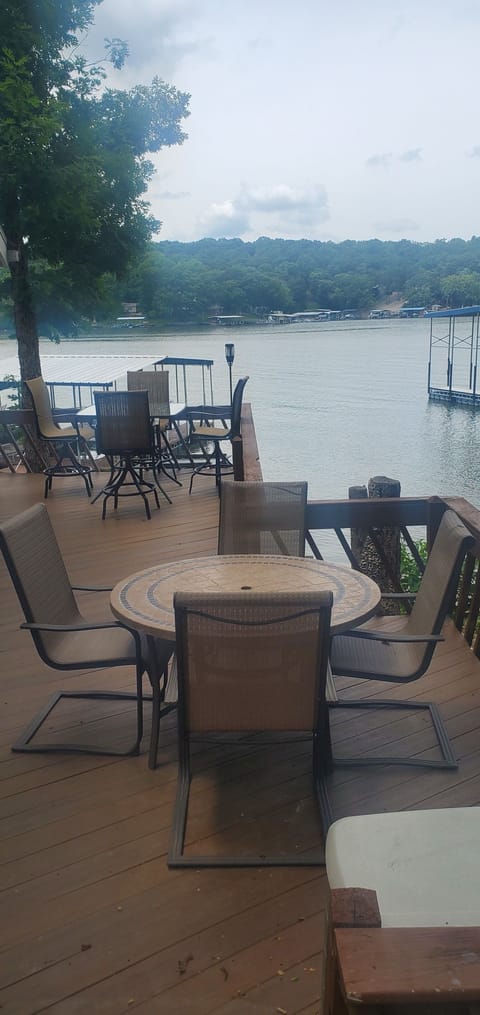 Outdoor dining area on the deck overlooking the lake.