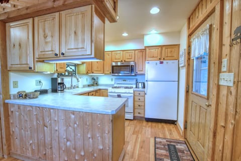 Private kitchen with gas stove, dishwasher and microwave.