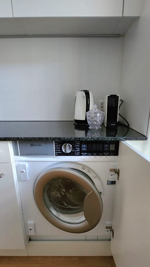 Washing machine in the apartment equipped with dryer function for our guests exclusive use.