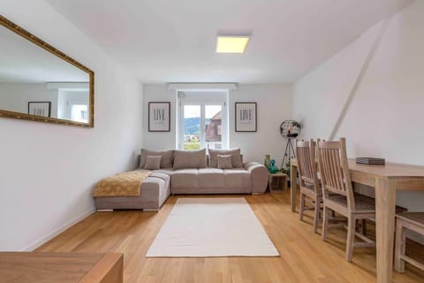 Living room with a sofa bed that sleeps up to 2 pax (and has a door for privacy).

Sofa bed can be prepared on request (additional charge applies). 

For group of 5/6, sofa bed is included in the rental price.