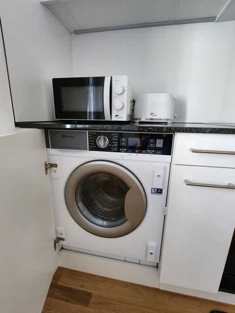 Washing machine in the apartment equipped with dryer function for our guests exclusive use.