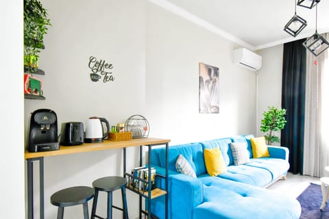 Enjoy our bright and airy living space with stylish decor, perfect for socializing or unwinding. Features a large window with a beautiful view. Contact us now to secure your dates!