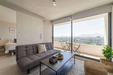 Enjoy stunning city views from this chic studio with a cozy living area and private balcony, perfect for relaxation.