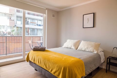 Relax in this bright and cozy bedroom with a private balcony, perfect for enjoying your morning coffee.