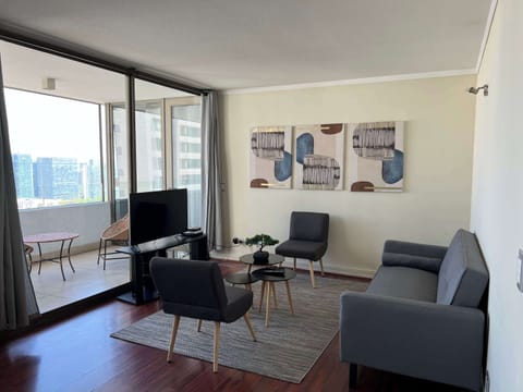 Bright and modern living area with city views, perfect for relaxing after exploring the vibrant surroundings.